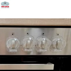 Stove Knob Safety Covers installed on kitchen stove controls