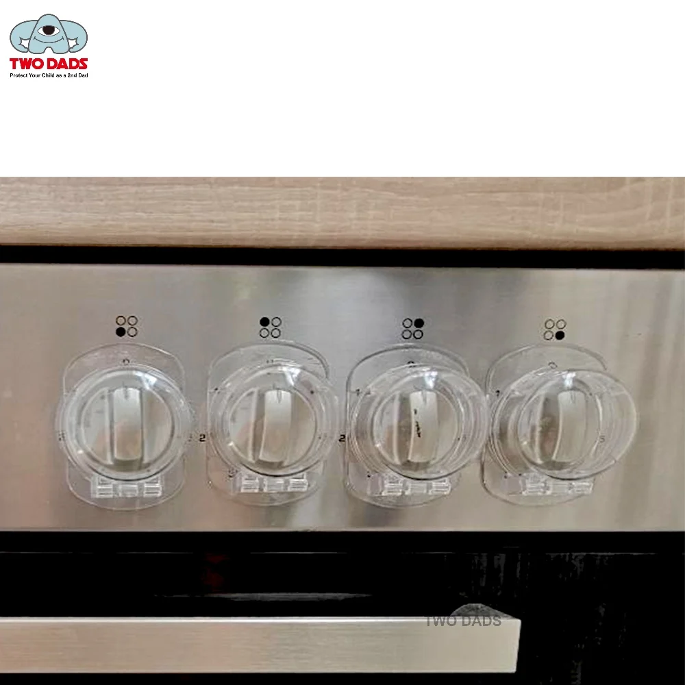 Stove Knob Safety Covers installed on kitchen stove controls